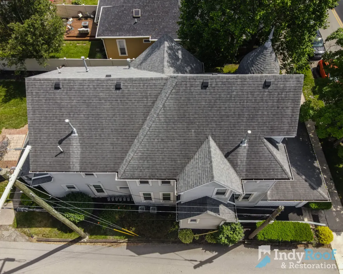 Architectural shingles with ridge vent before restoration in Hamilton County, IN